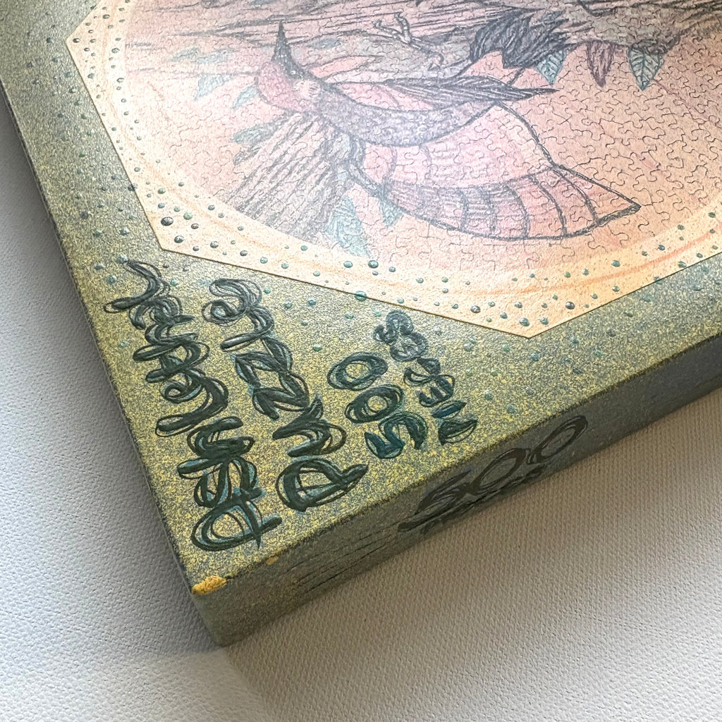 Close-up of a puzzle box with text and a colorful illustration on a white background