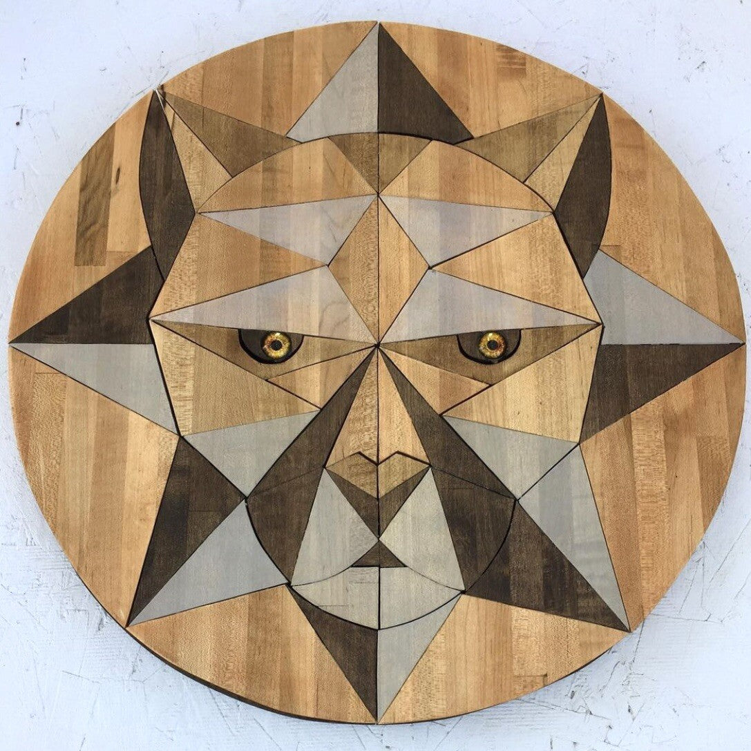 Wooden circular Butcher block wood art with geometric lion face design on a white gallery walla background by artist SS Design