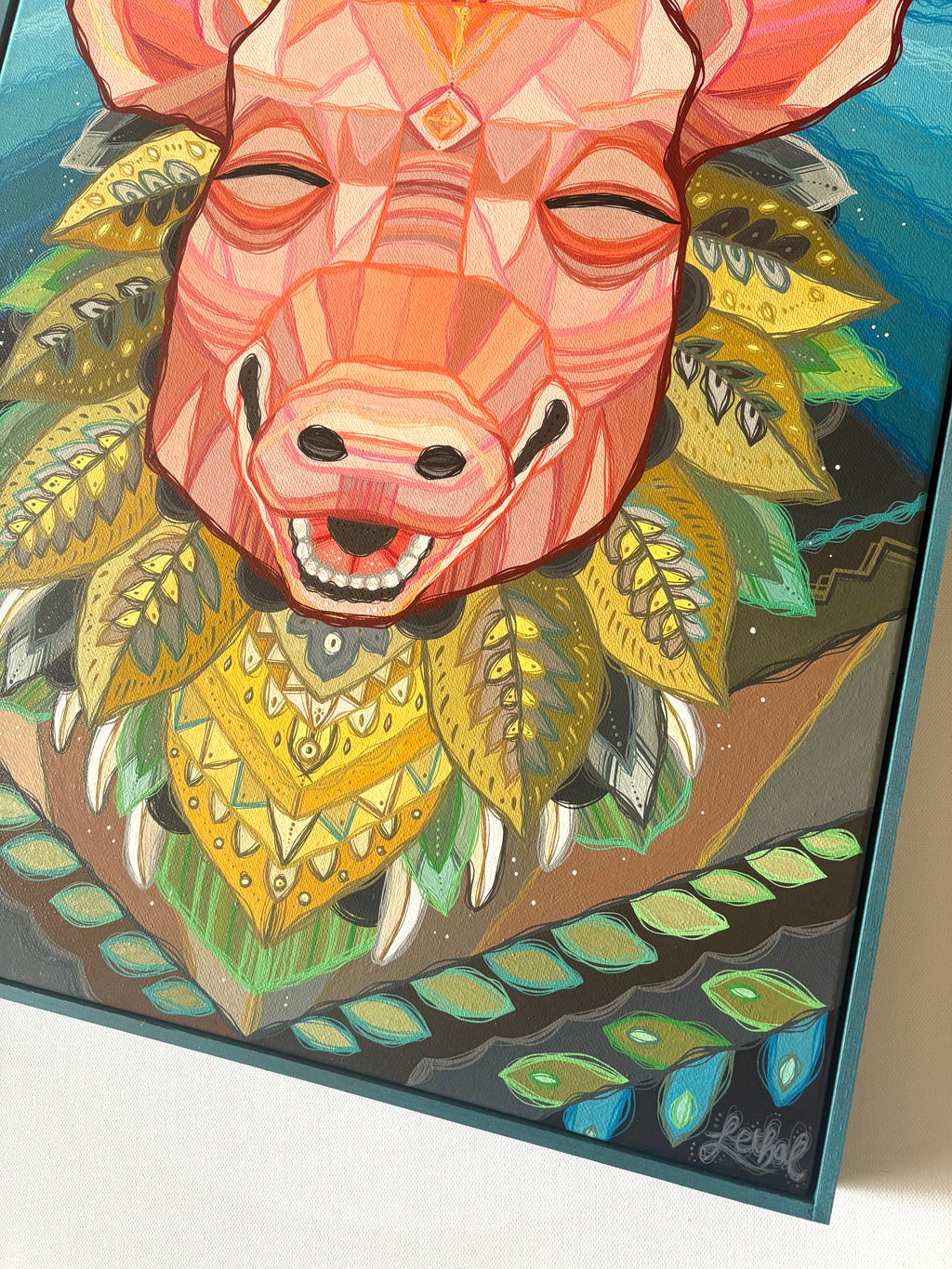 Colorful artwork of a pig boar's head with geometric patterns and leaves.