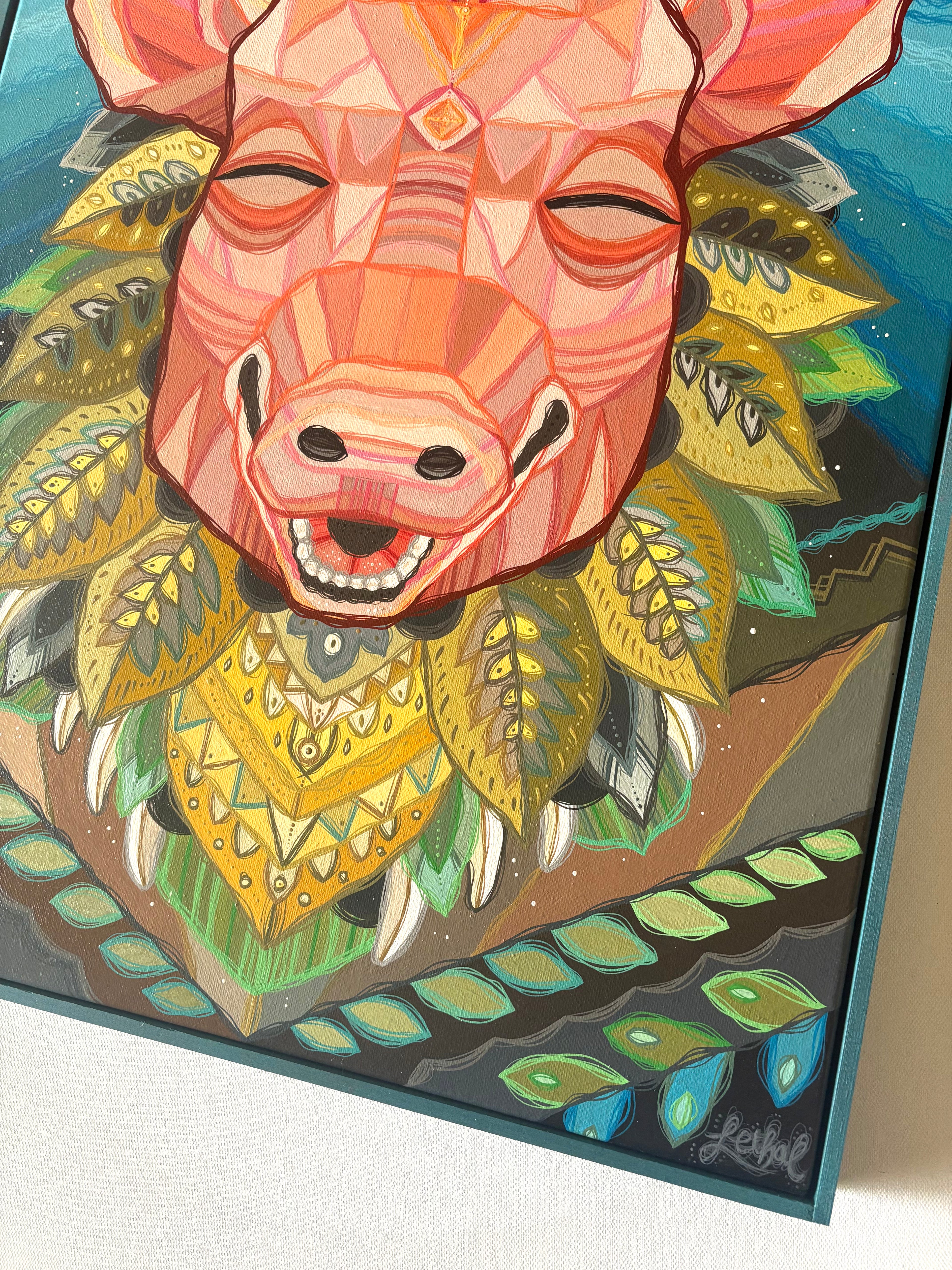 Colorful artwork of a pig boar's head with geometric patterns and leaves.