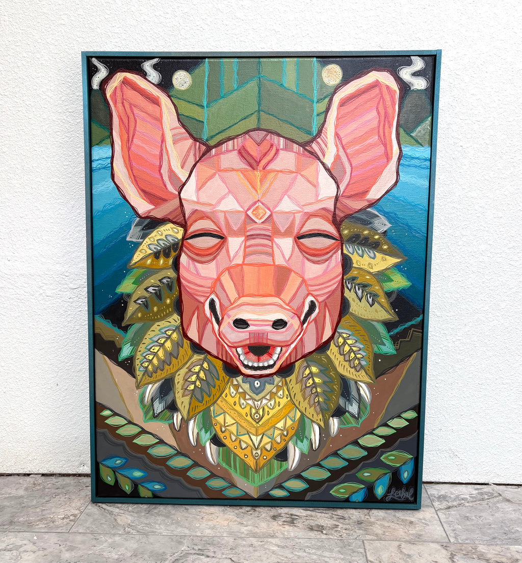 Colorful geometric pig art piece on a white wall