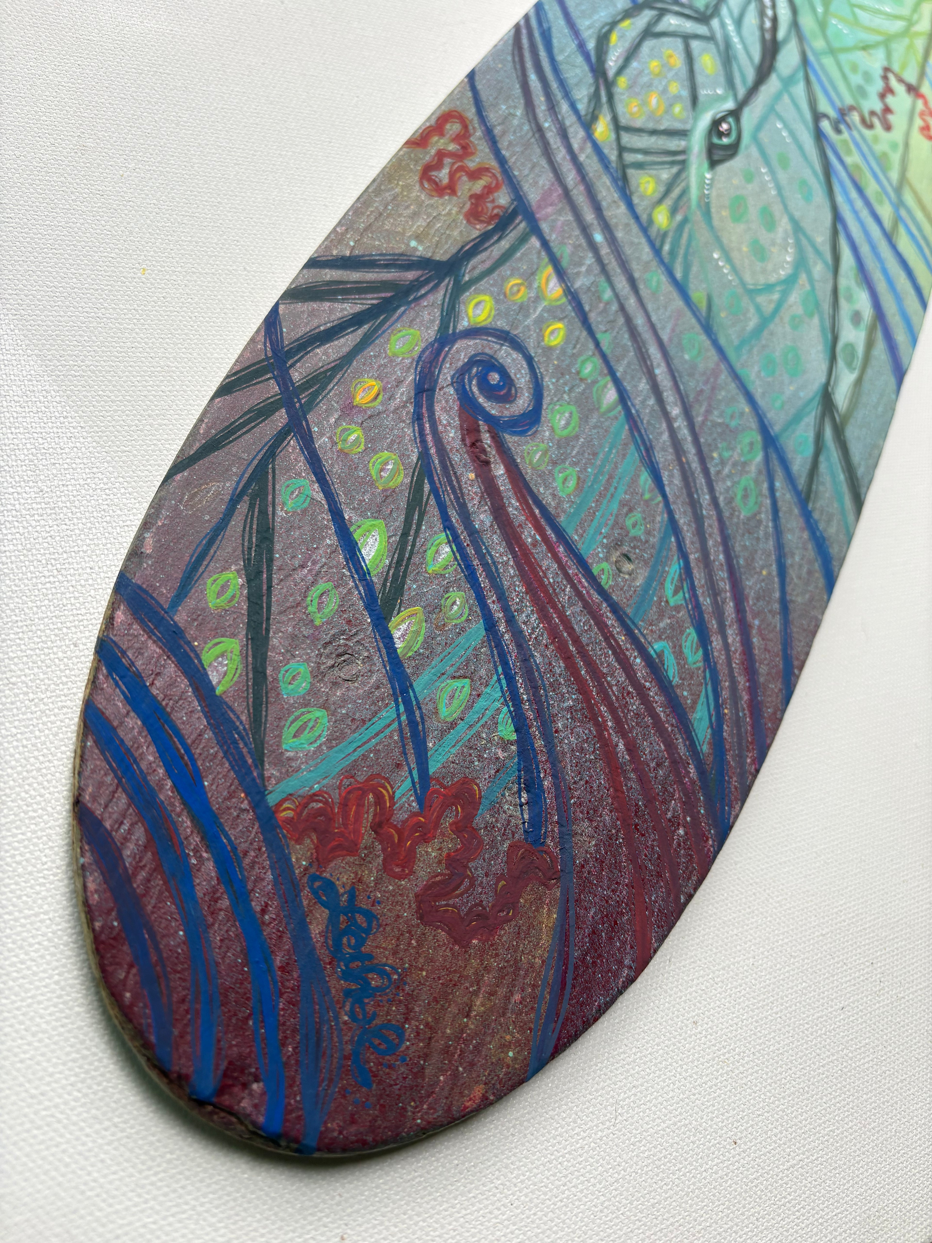 Colorful abstract art piece on a white background of dolphins 