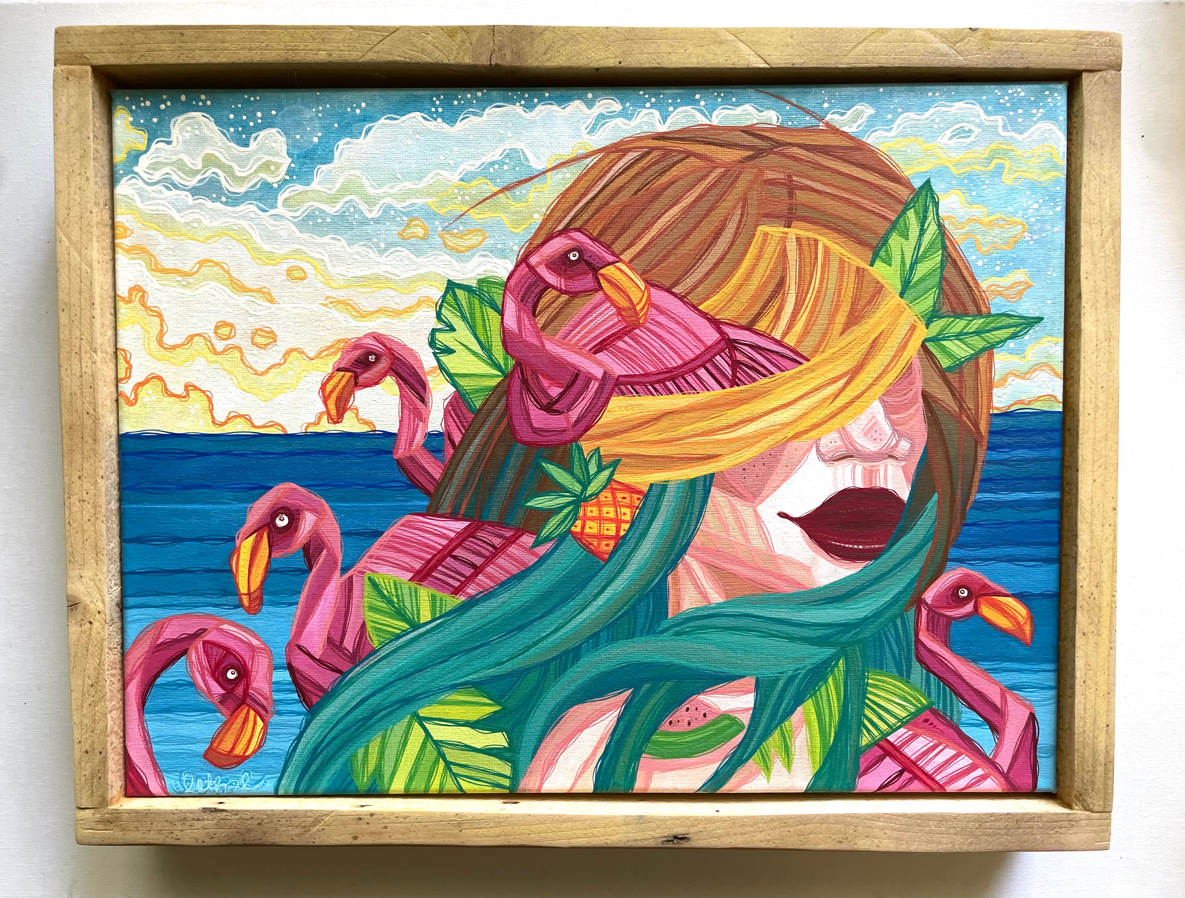 Colorful artwork of a woman with flamingos and a tropical setting in a wooden frame.