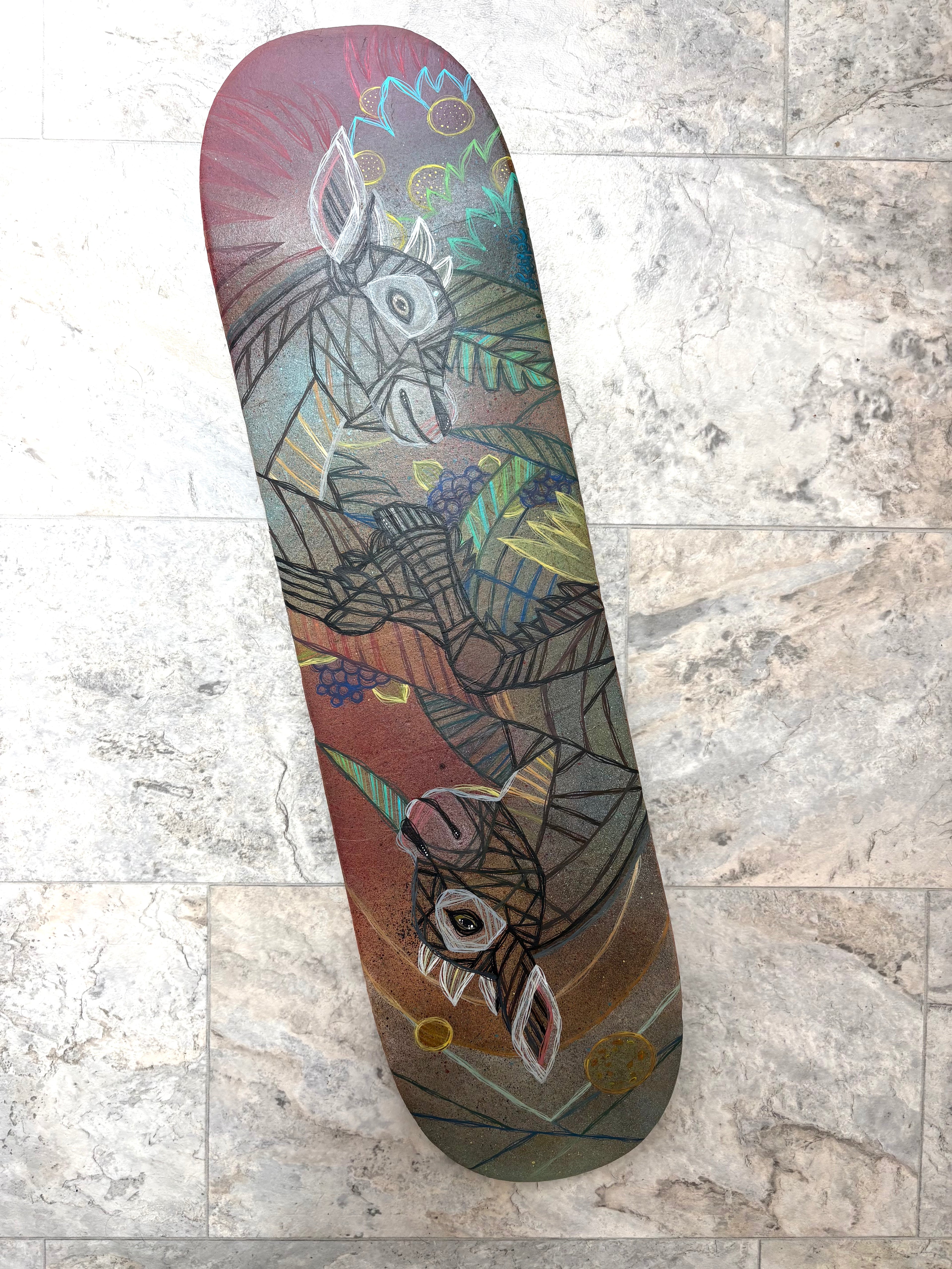 Skateboard deck with geometric goats design on a textured surface