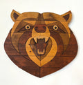 Wooden bear head wall art on a white background