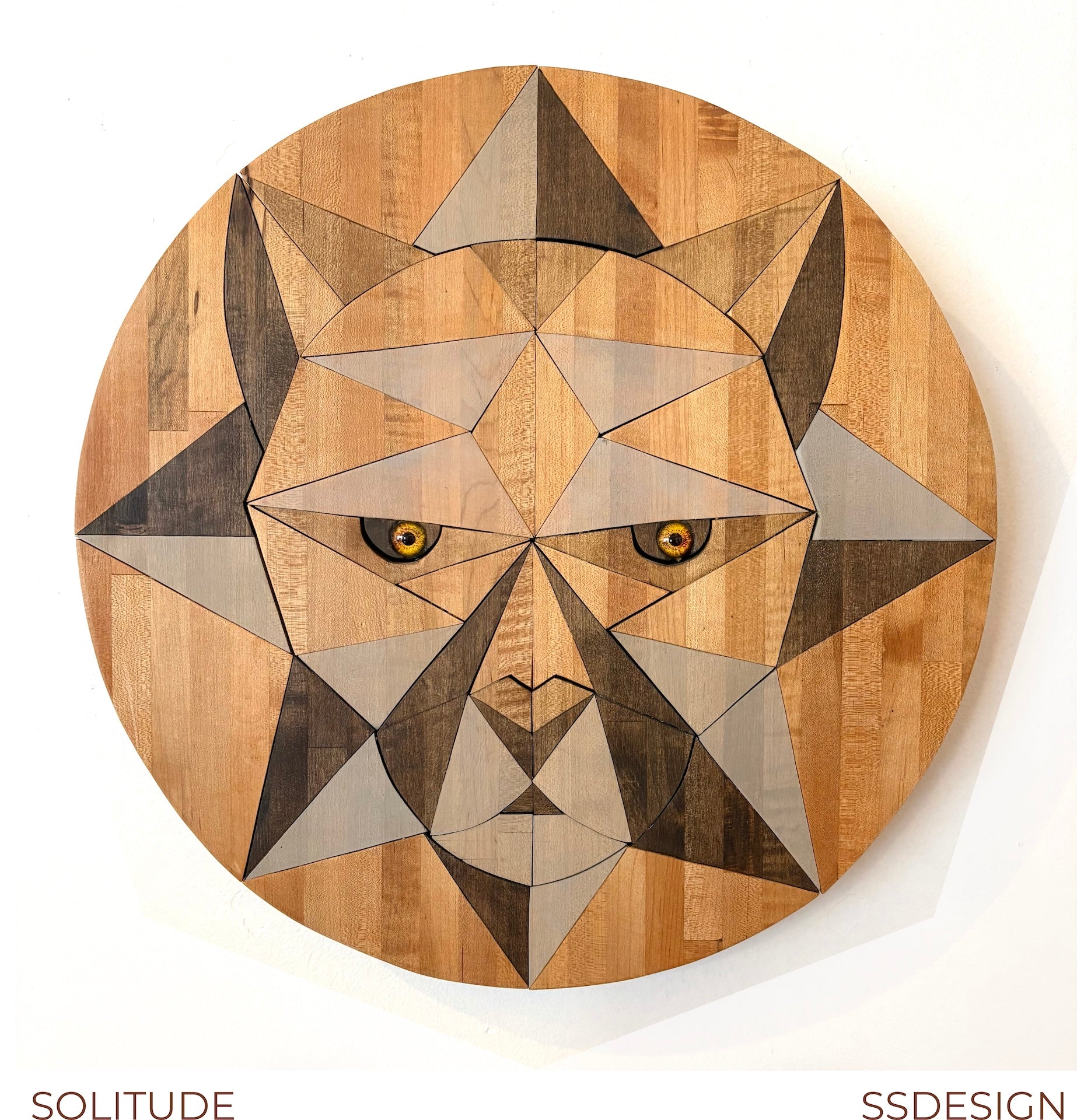 Wooden wall art with geometric design of a cougar big cat lion face, labeled 'SOLITUDE' by 'SSDesign'.