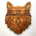 Wooden wolf head wall art on a white background