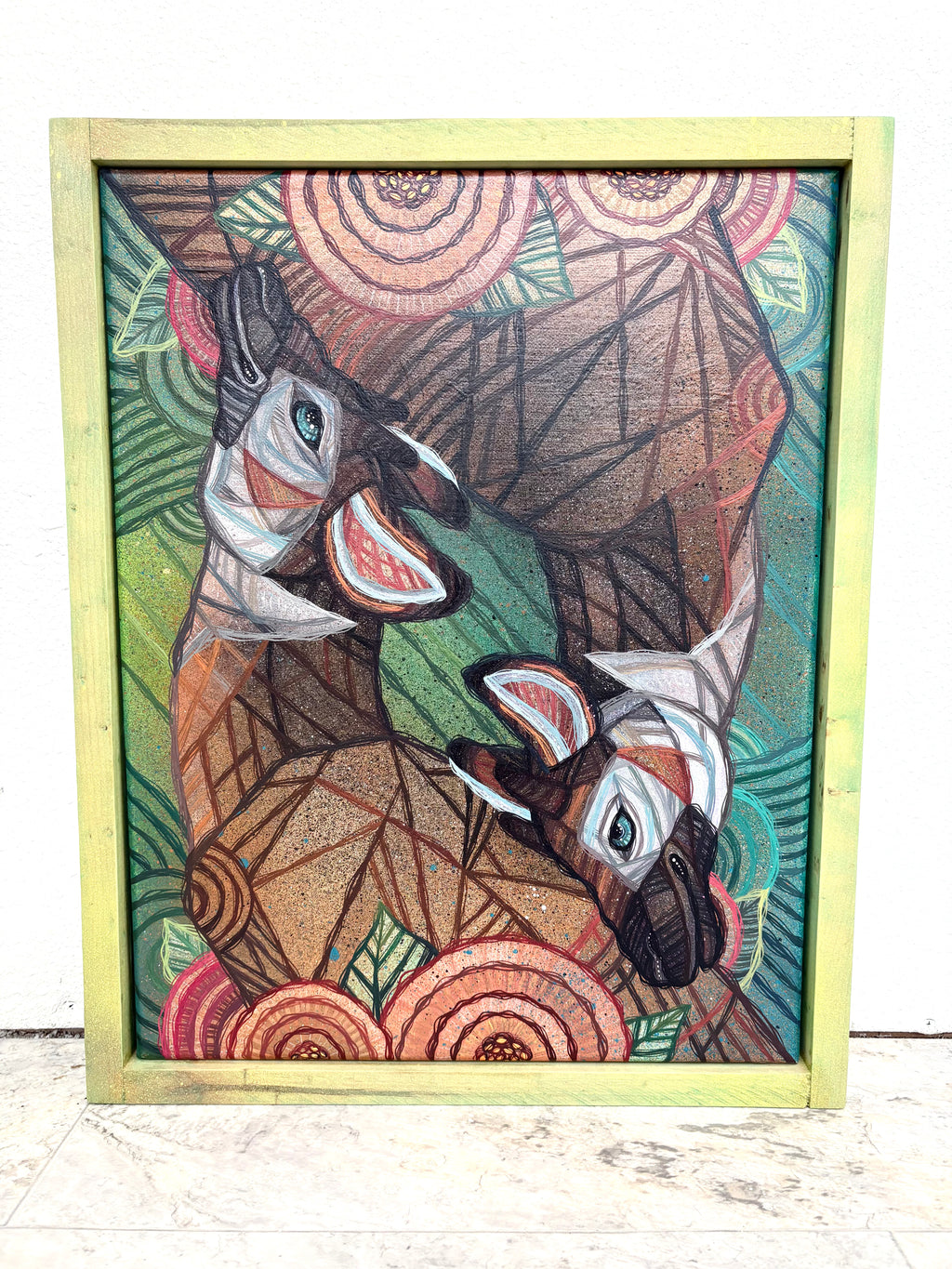 Geometric abstract art of two okapi animals in a wooden frame