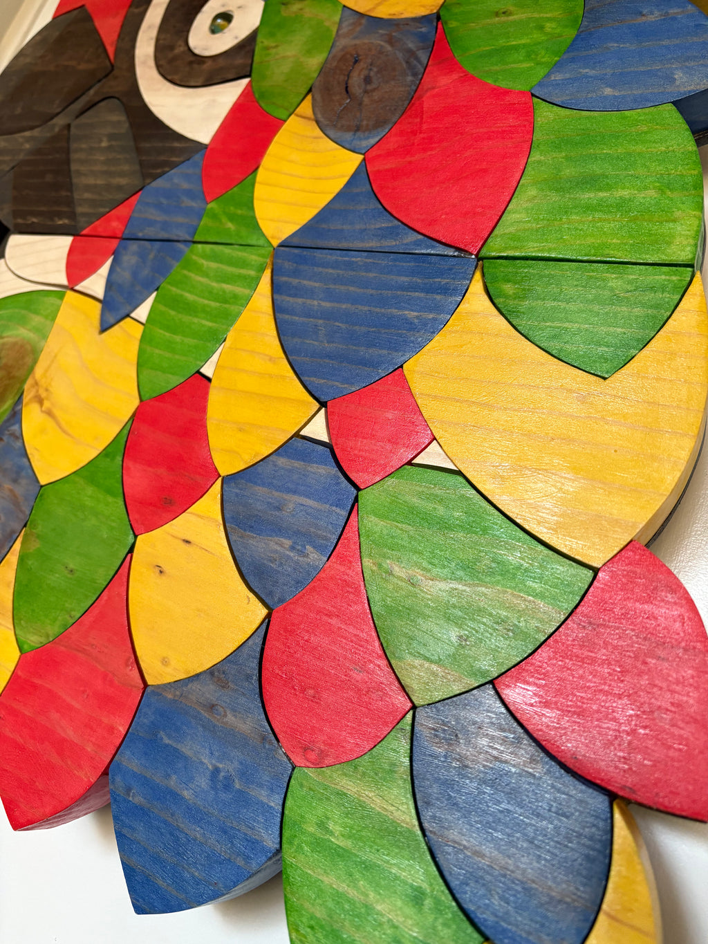 Colorful wooden puzzle shaped like a parrot, original wood art of macaw bird from artist SS Design