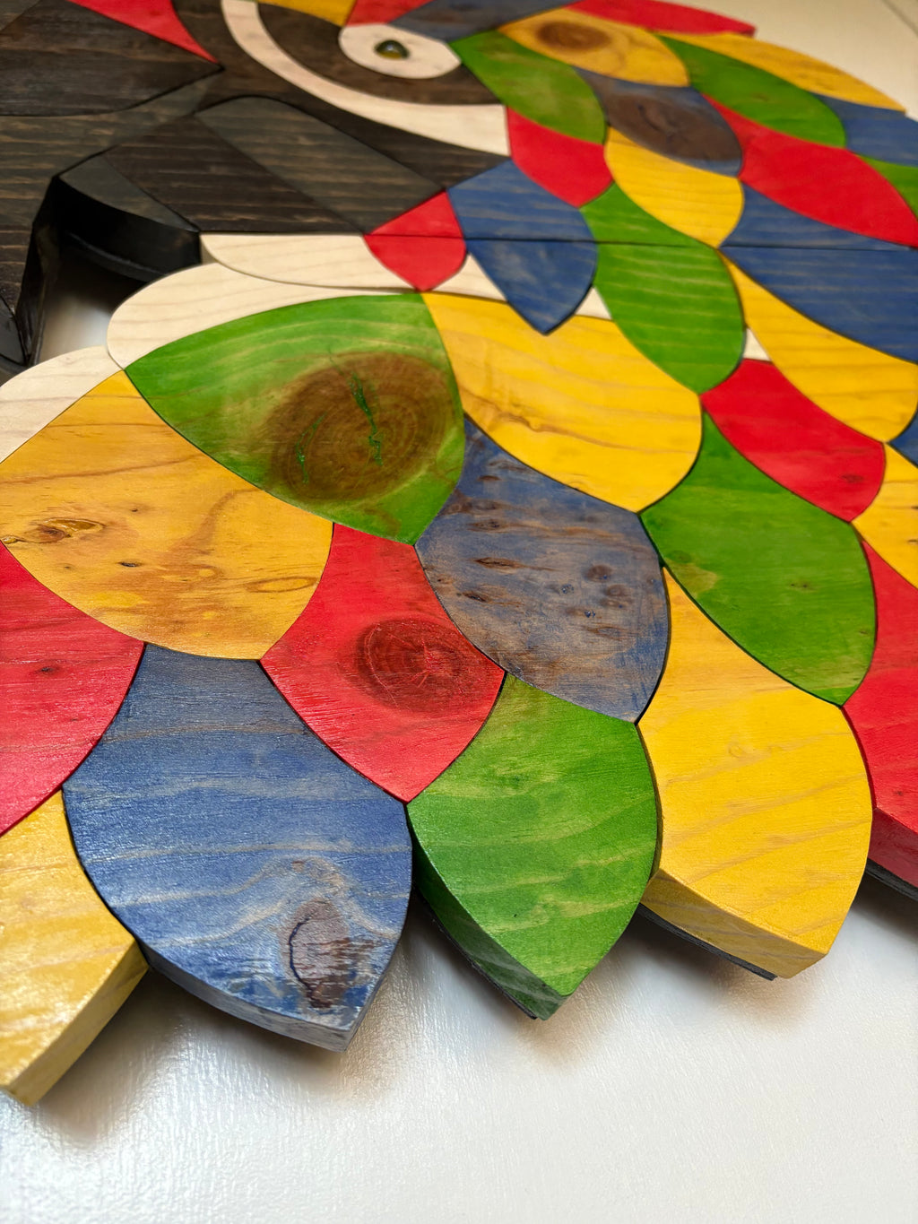 Colorful wooden puzzle pieces wood art of a colorful macaw parrot by artist SSDesign 