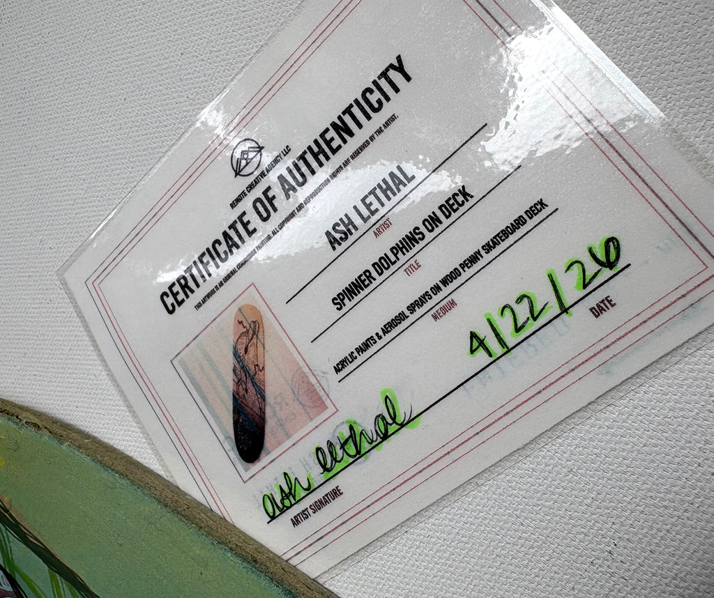 Certificate of Authenticity for a skateboard deck with a clear plastic laminate overlay.