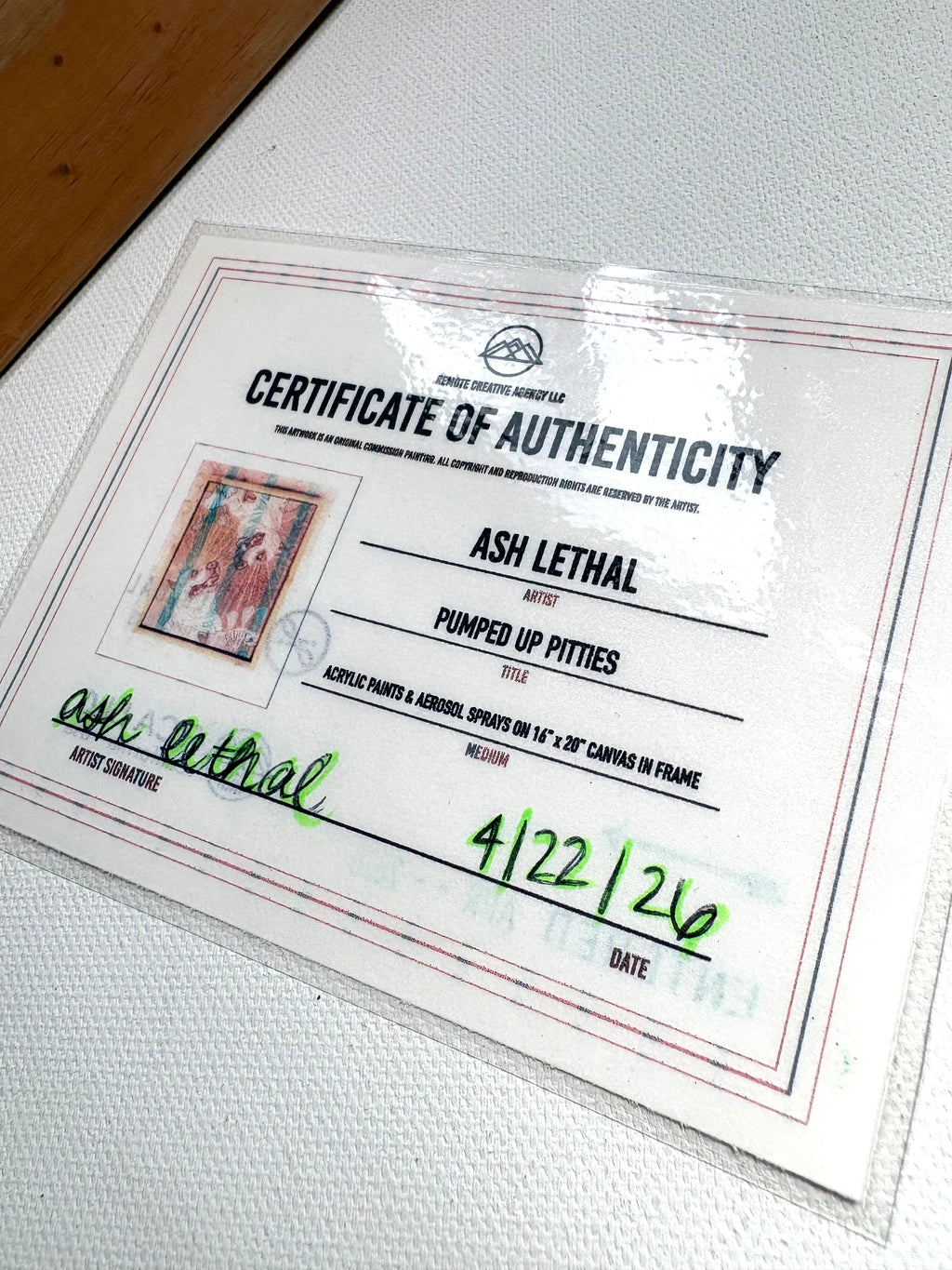 Certificate of Authenticity for an artwork by Ash Lethal on a white surface.