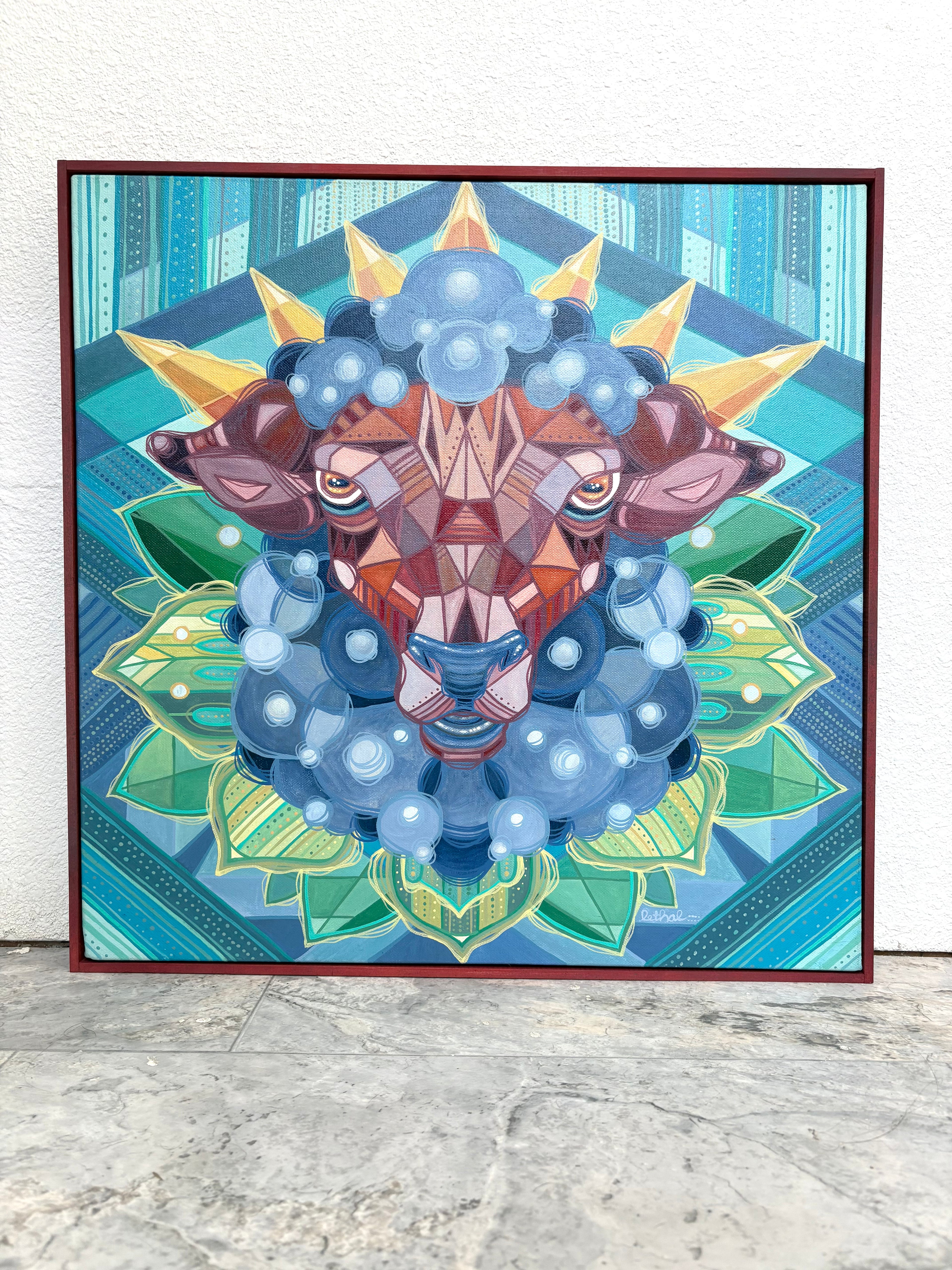 Framed artwork of a geometric sacred lamb sheep deer head with blue and brown colors on a patterned background.