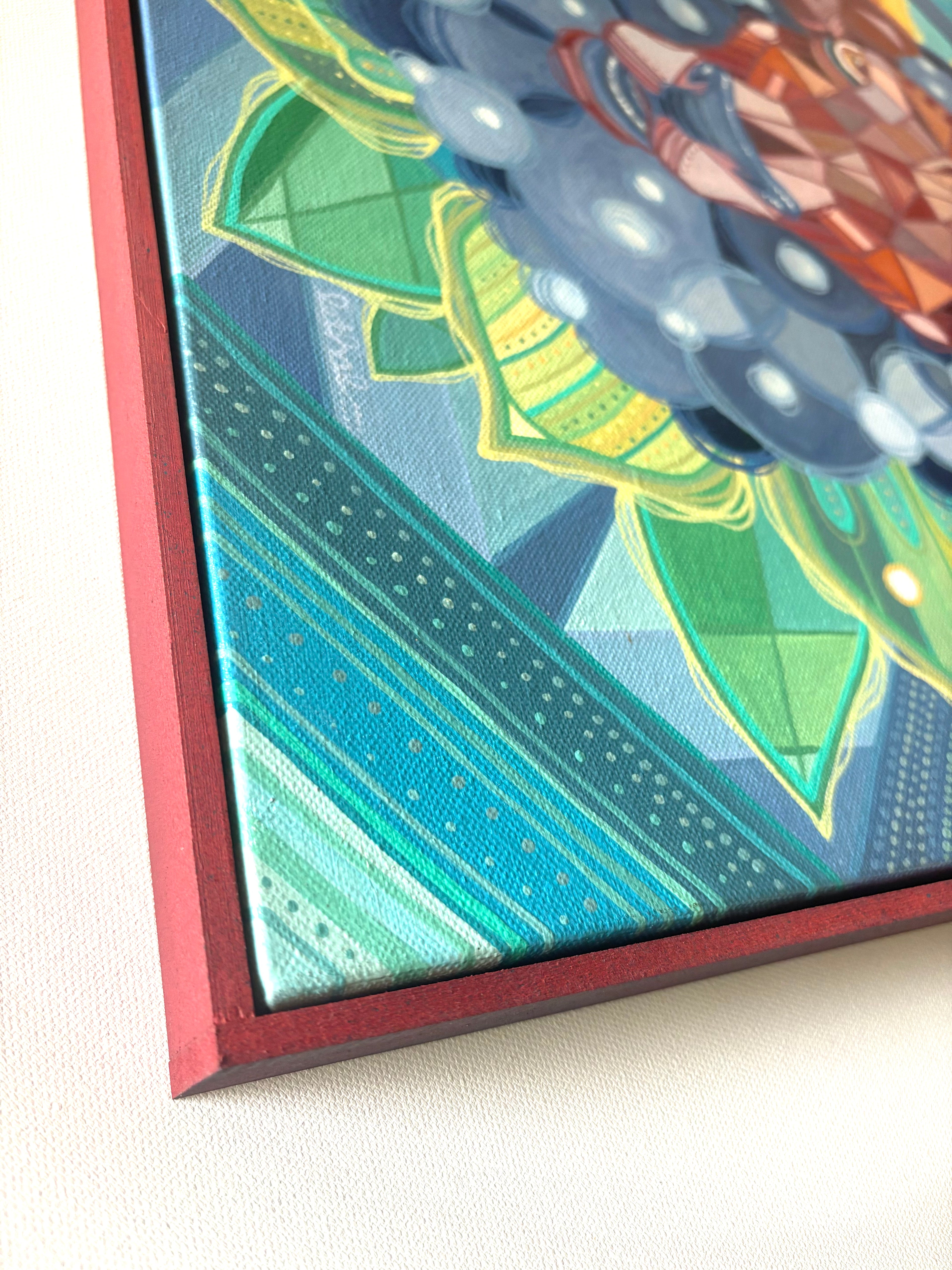 Close-up of a colorful canvas painting with geometric patterns and a red frame