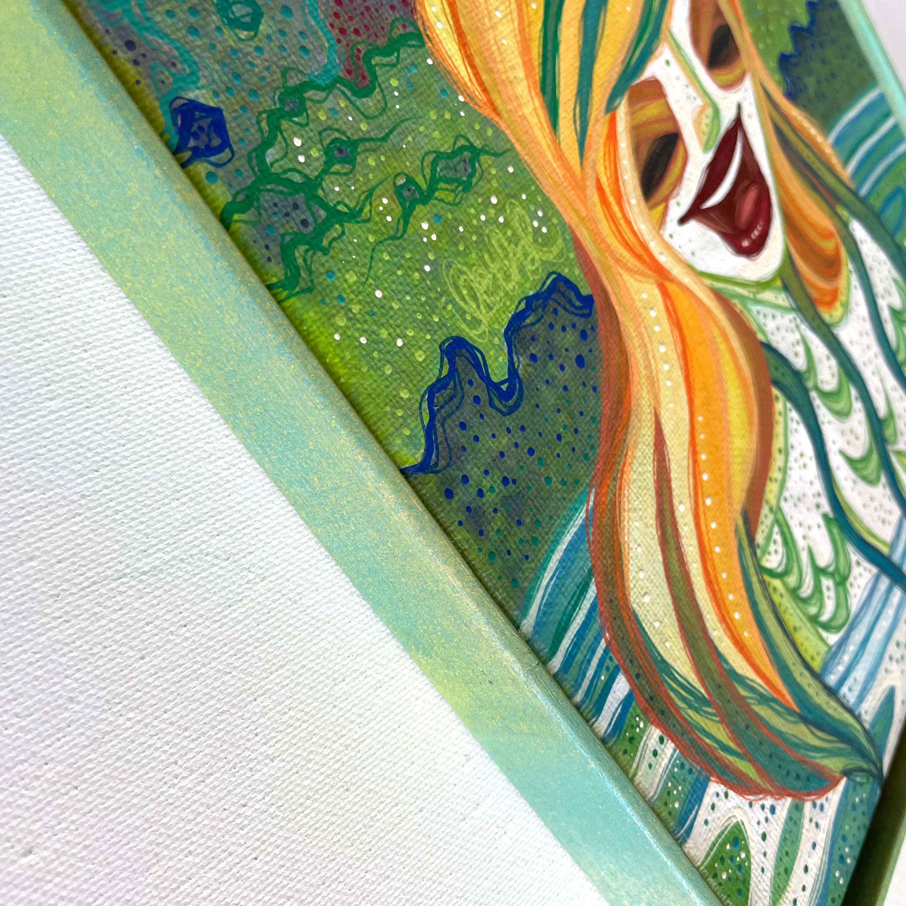 Colorful abstract painting with a feminine energy laughing face and flowing hair on a textured white background.