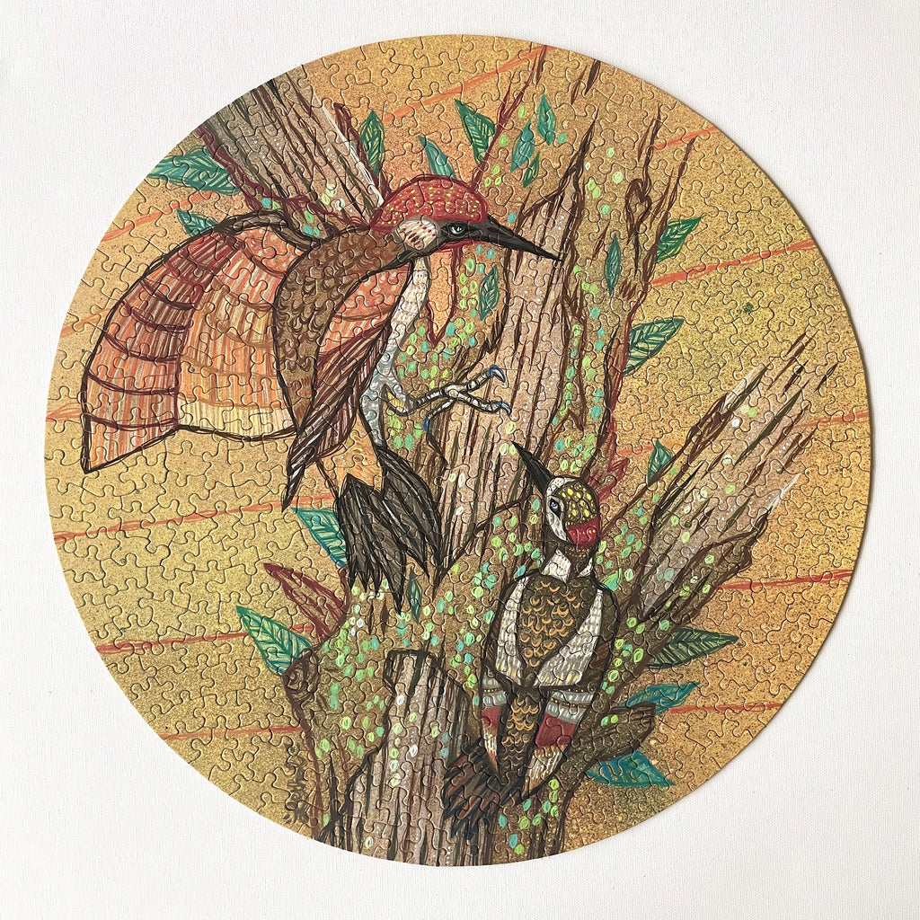 Round puzzle piece with illustration of two birds on a branch