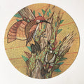 Round puzzle piece with illustration of two birds on a branch