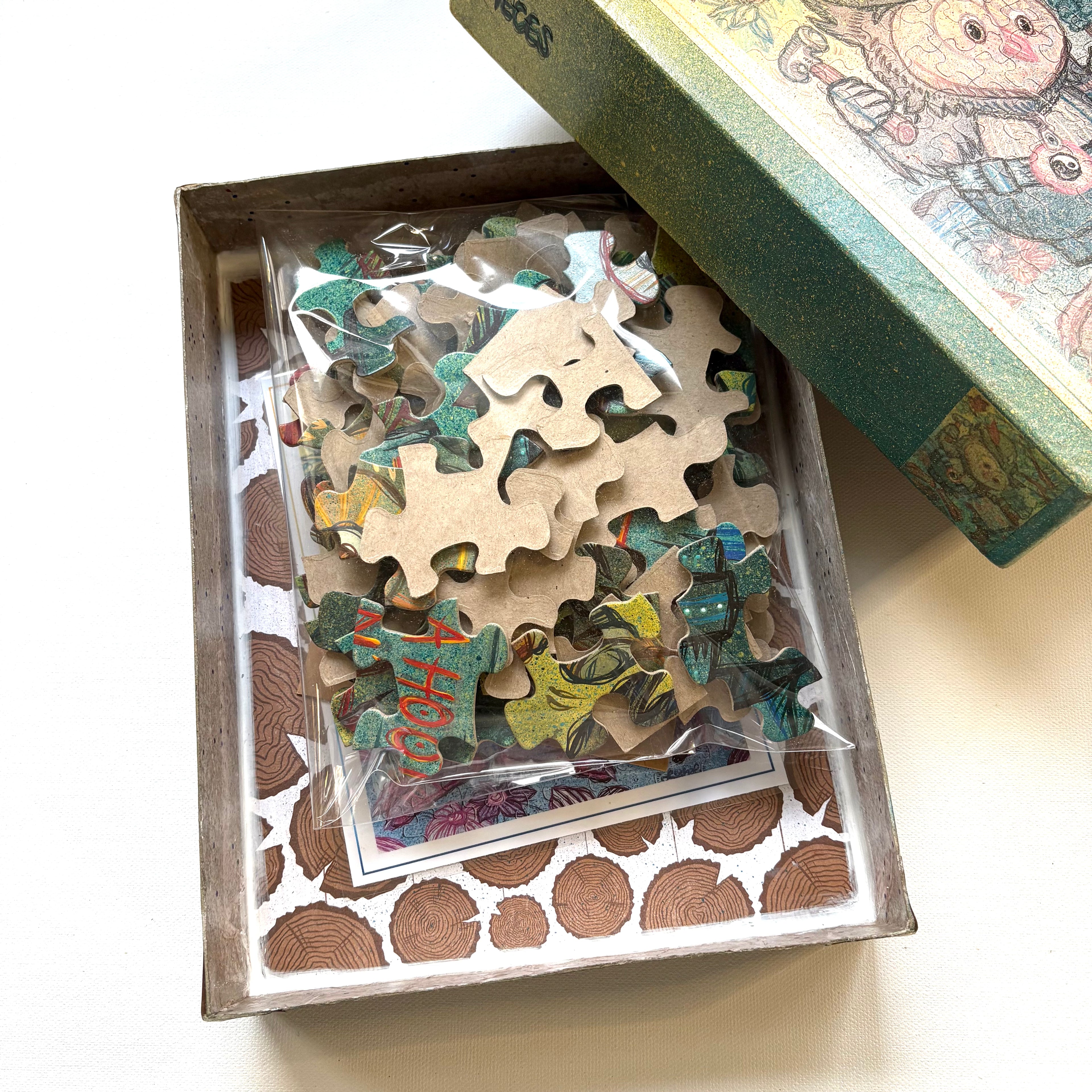 Customized Vintage Pop Art Jigsaw puzzle pieces in a decorative box on a white surface