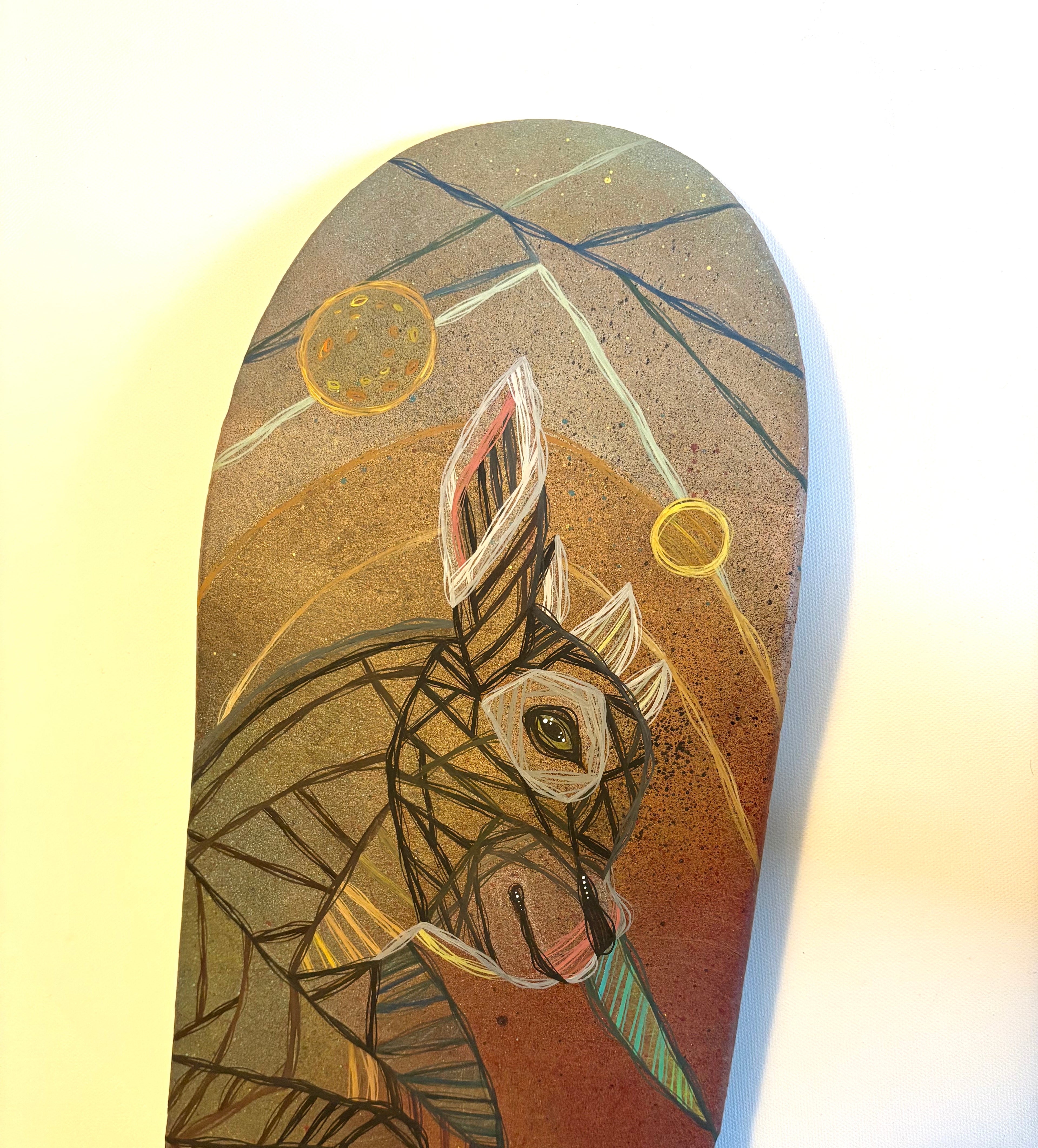 Skateboard deck with abstract design of a goat on a white background by ash lethal