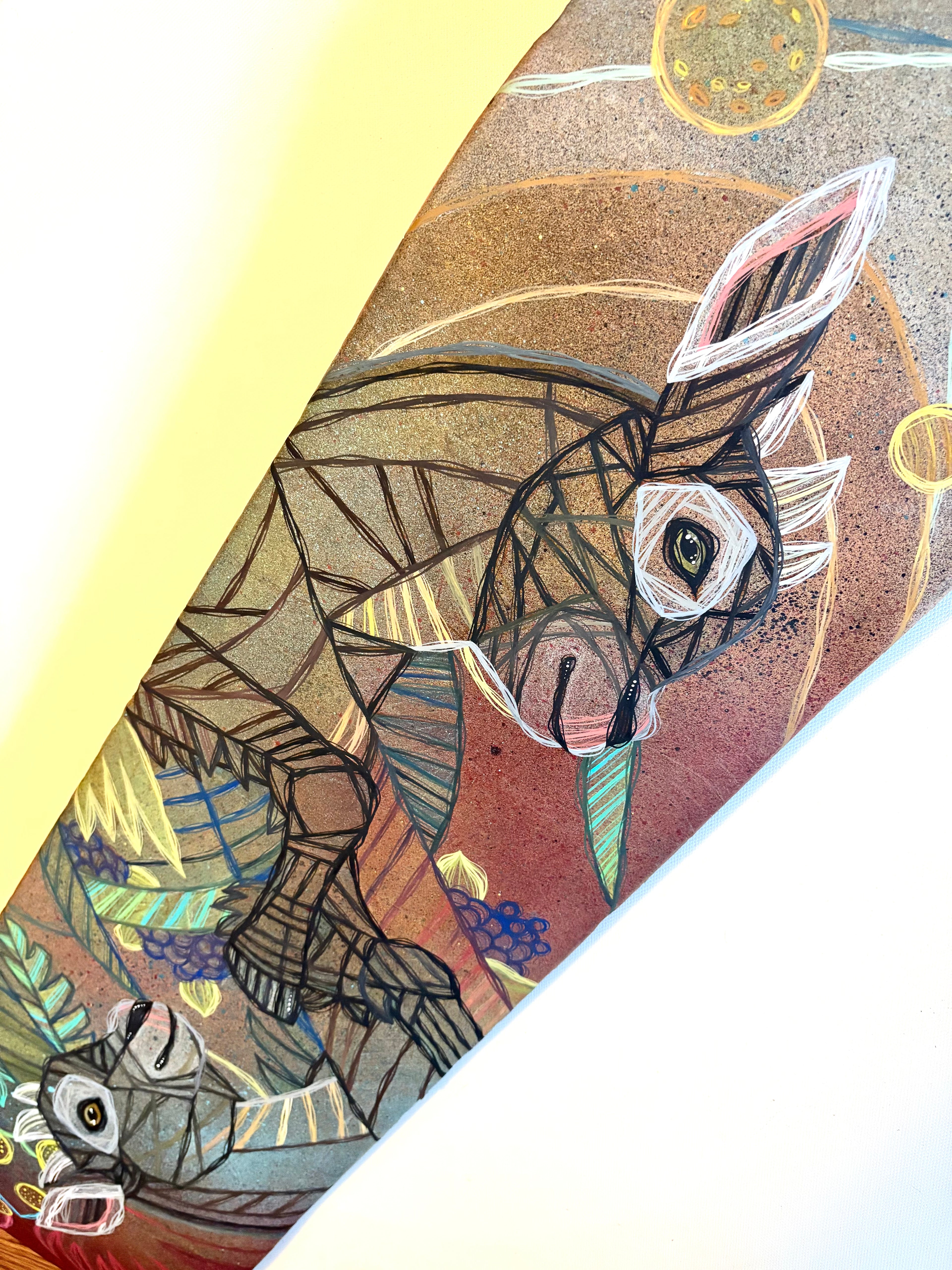 Colorful abstract design with a donkey-like goat animal on a textured background