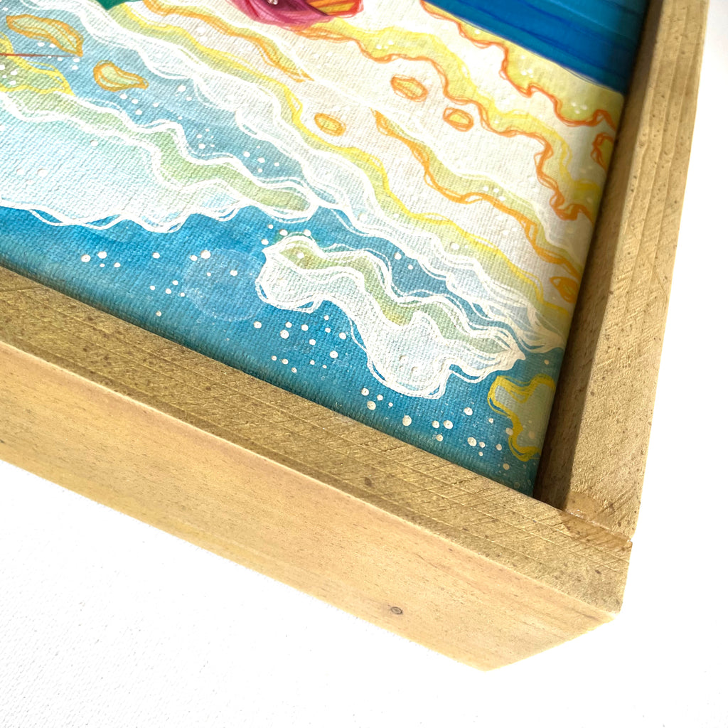 Framed artwork with a colorful abstract design on a white background