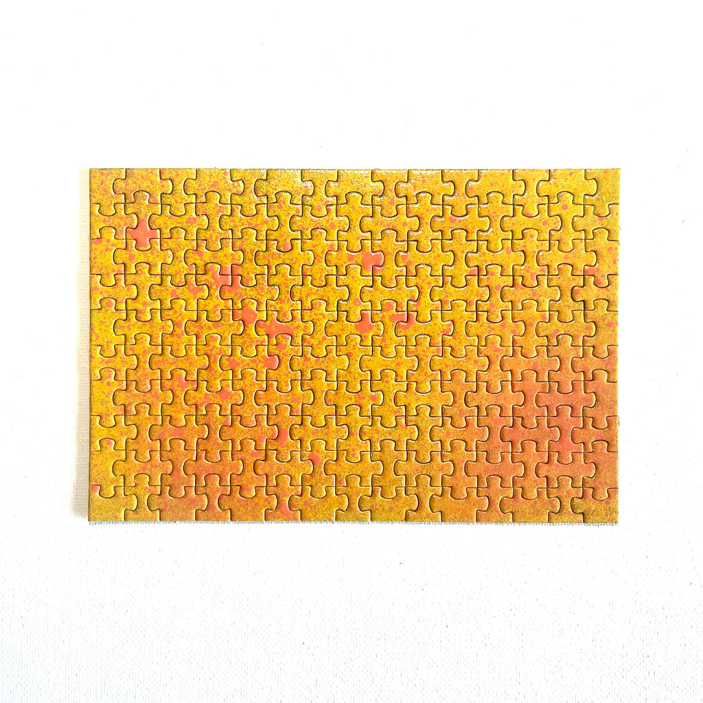 Jigsaw puzzle with a gradient of yellow to orange on a white background