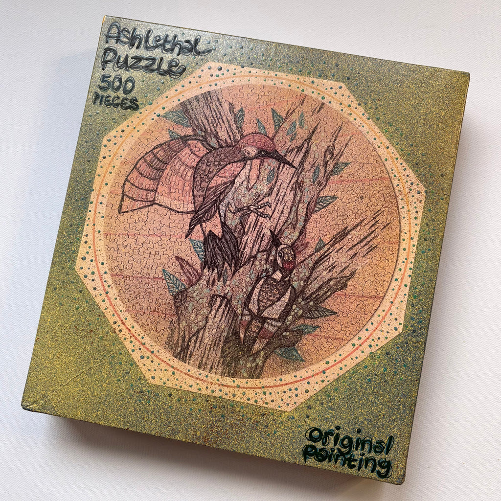 Puzzle box with bird illustration and 'original painting' text on a white background