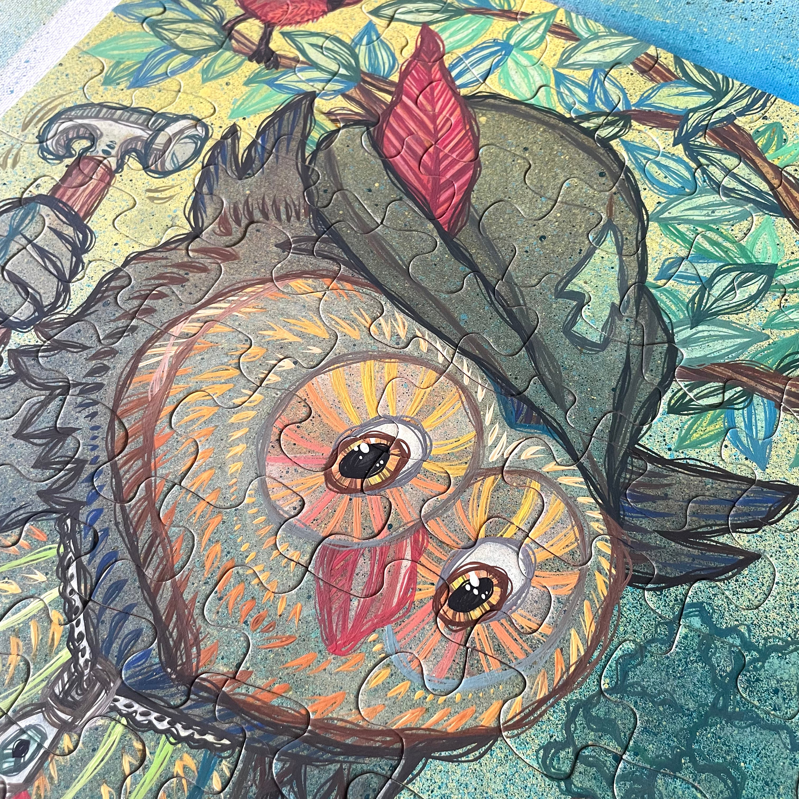 Close-up of a puzzle with a painted owl design on a colorful background
